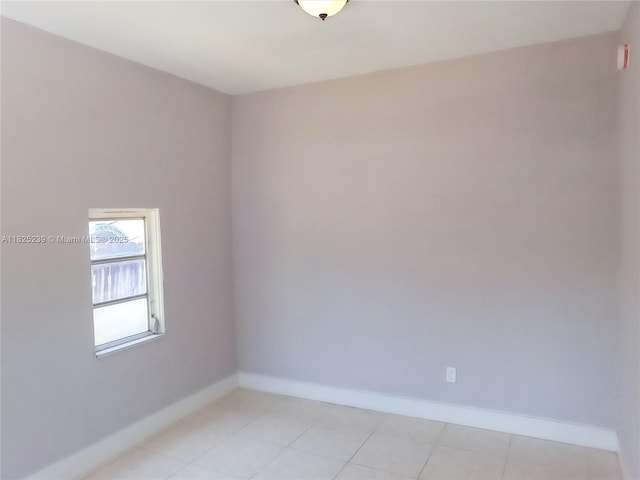 1051 NW 63rd St, Miami, FL 33150 - unfurnished room featuring baseboards and light tile patterned floors