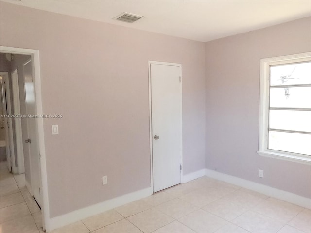 1051 NW 63rd St, Miami, FL 33150 - spare room with baseboards and light tile patterned floors