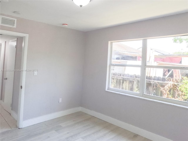 1051 NW 63rd St, Miami, FL 33150 - unfurnished room with plenty of natural light and light wood-style flooring