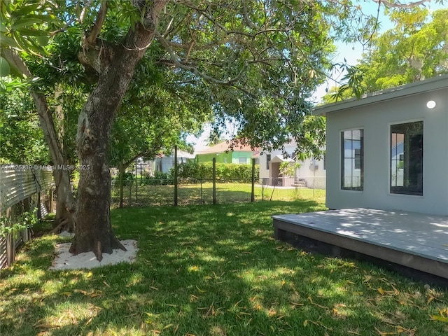 1051 NW 63rd St, Miami, FL 33150 - view of yard with a deck