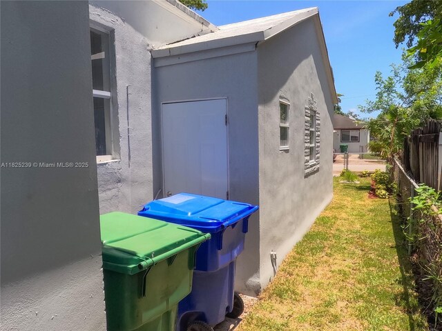 1051 NW 63rd St, Miami, FL 33150 - view of side of home with stucco siding