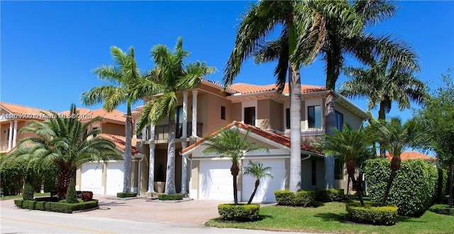 19383 SW 79th Ave, Cutler Bay, FL 33157 - view of front facade with a balcony, a tile roof, stucco siding, concrete driveway, and an attached garage