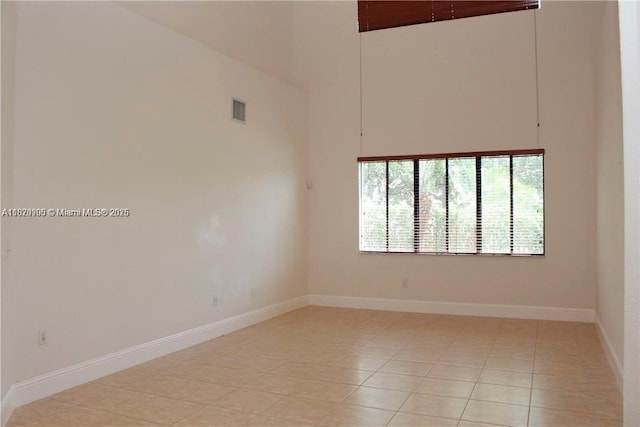 19383 SW 79th Ave, Cutler Bay, FL 33157 - unfurnished room with a high ceiling and light tile patterned floors
