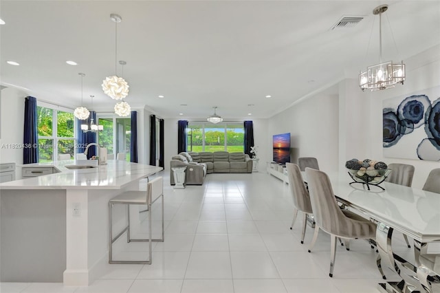 13307 SW Green Delta Rd, Port St Lucie, FL 34987 - dining room featuring a chandelier, recessed lighting, and light tile patterned floors