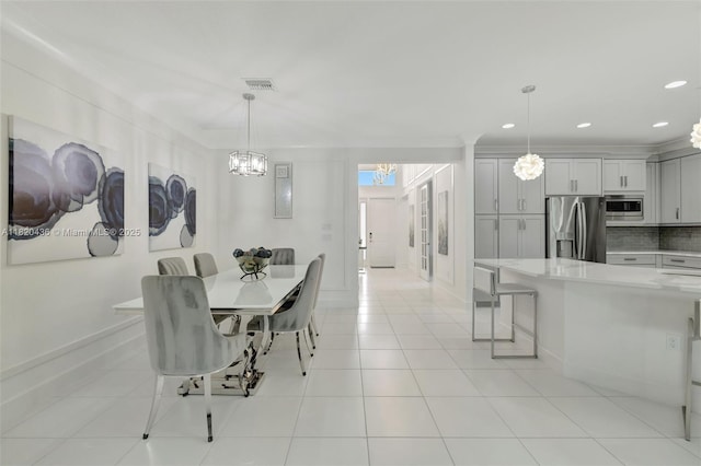 13307 SW Green Delta Rd, Port St Lucie, FL 34987 - dining room featuring a chandelier, recessed lighting, and light tile patterned floors