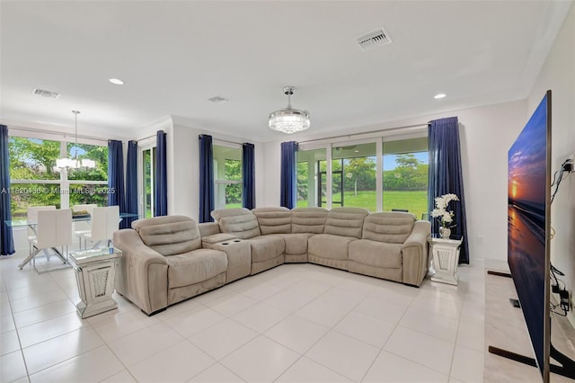 13307 SW Green Delta Rd, Port St Lucie, FL 34987 - living room with a chandelier, light tile patterned flooring, and recessed lighting