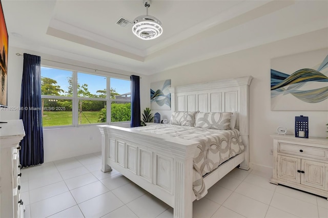 13307 SW Green Delta Rd, Port St Lucie, FL 34987 - bedroom featuring light tile patterned floors and a tray ceiling