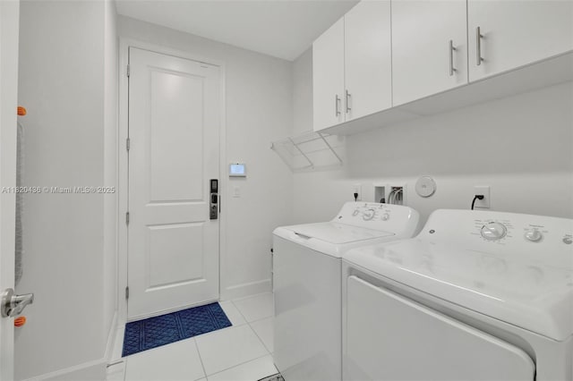 13307 SW Green Delta Rd, Port St Lucie, FL 34987 - laundry room featuring washing machine and clothes dryer, cabinet space, and light tile patterned flooring