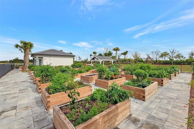 13307 SW Green Delta Rd, Port St Lucie, FL 34987 - view of patio / terrace with a gazebo and a vegetable garden
