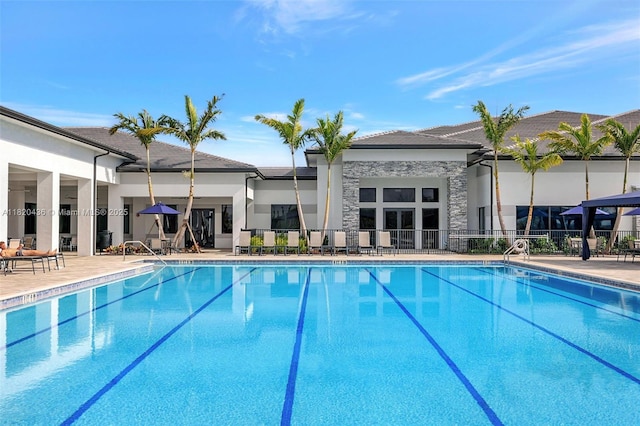 13307 SW Green Delta Rd, Port St Lucie, FL 34987 - community pool featuring a patio