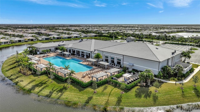 13307 SW Green Delta Rd, Port St Lucie, FL 34987 - aerial perspective of suburban area with a pool and a nearby body of water