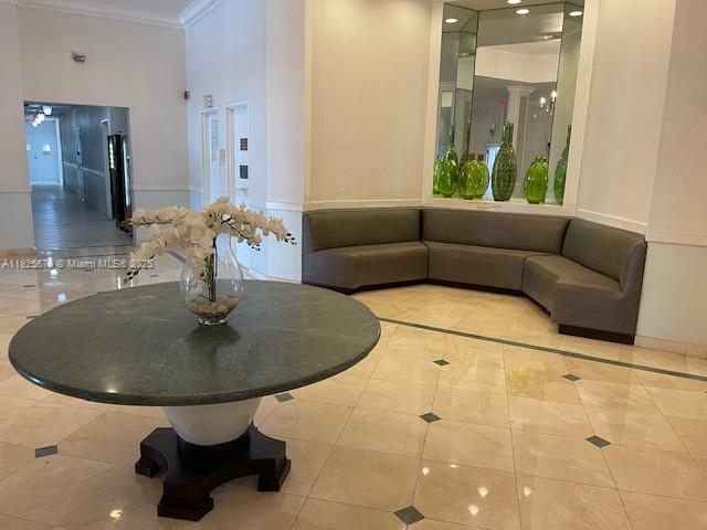 1351 NE Miami Gardens Dr Unit 1014E, Miami, FL 33179 - community lobby with crown molding and recessed lighting
