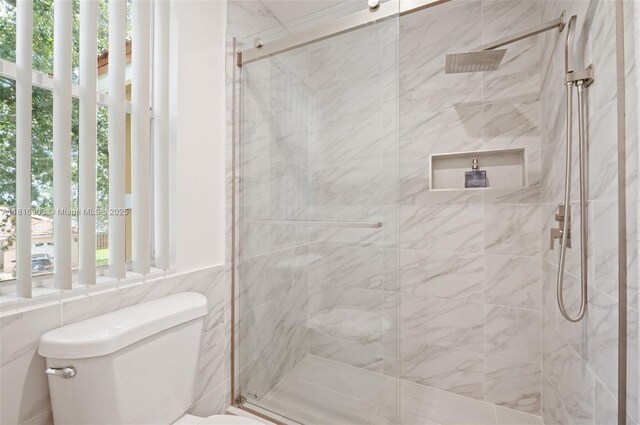 4333 SW 84th Ter, Davie, FL 33328 - bathroom with a marble finish shower and tile walls