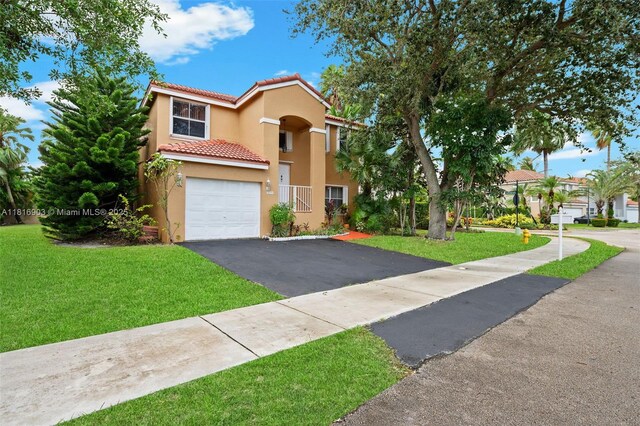 4333 SW 84th Ter, Davie, FL 33328 - view of front of home featuring a tiled roof, stucco siding, driveway, and a front yard