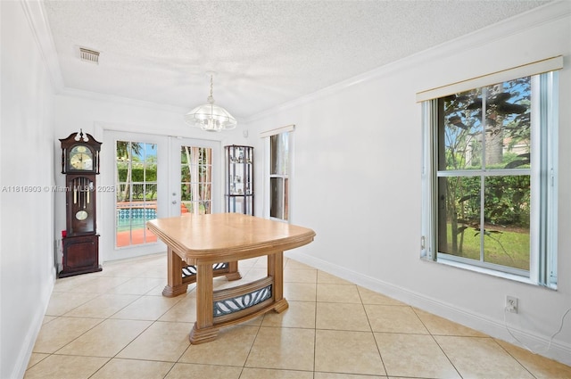 4333 SW 84th Ter, Davie, FL 33328 - dining area featuring ornamental molding, a textured ceiling, a chandelier, french doors, and light tile patterned floors