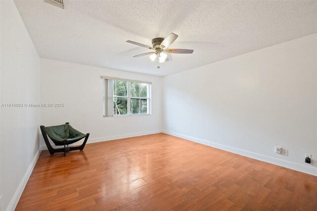 4333 SW 84th Ter, Davie, FL 33328 - unfurnished room with ceiling fan, light wood-type flooring, and a textured ceiling