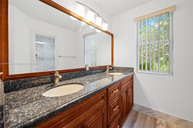 4333 SW 84th Ter, Davie, FL 33328 - bathroom with double vanity, wood finished floors, and a shower with door