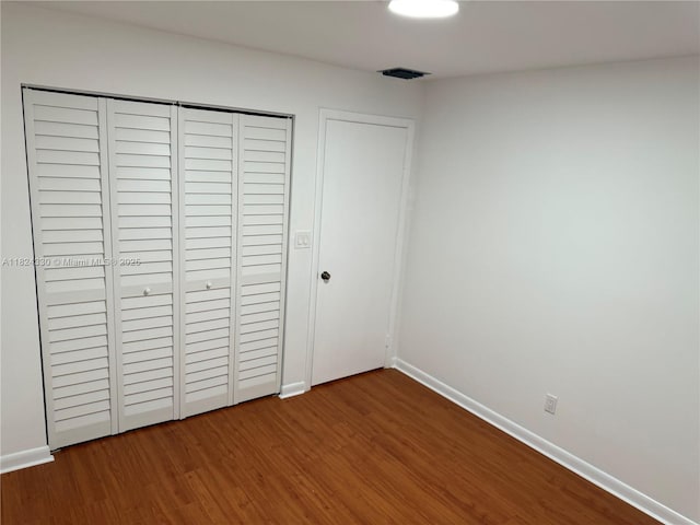 1143 NW 122nd Ter, Pembroke Pines, FL 33026 - unfurnished bedroom with wood finished floors and a closet
