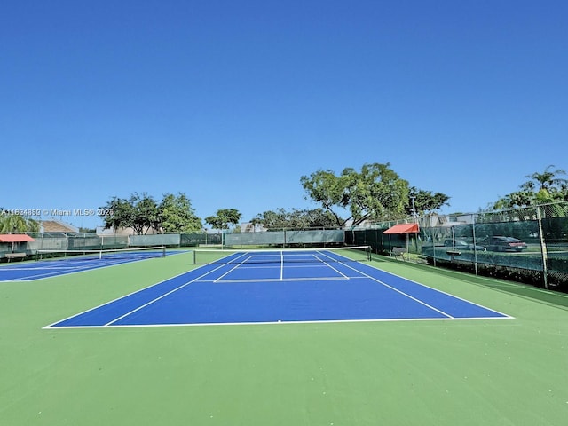 1143 NW 122nd Ter, Pembroke Pines, FL 33026 - view of tennis court with community basketball court