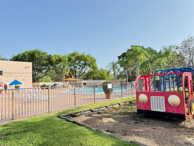 1143 NW 122nd Ter, Pembroke Pines, FL 33026 - view of jungle gym with a community pool