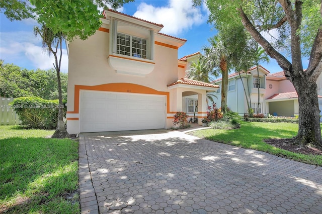 676 NW 133rd Dr, Plantation, FL 33325 - mediterranean / spanish home featuring a garage, stucco siding, a tiled roof, a front yard, and decorative driveway