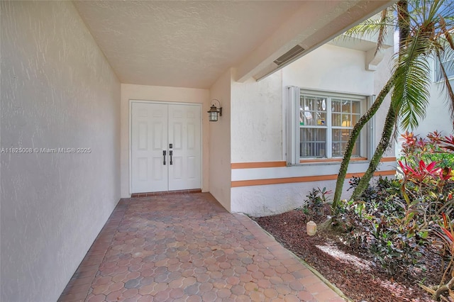 676 NW 133rd Dr, Plantation, FL 33325 - view of exterior entry featuring stucco siding