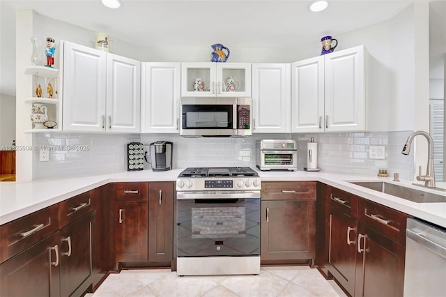 676 NW 133rd Dr, Plantation, FL 33325 - kitchen with stainless steel appliances, light countertops, white cabinetry, backsplash, and recessed lighting