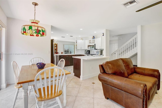 676 NW 133rd Dr, Plantation, FL 33325 - dining room featuring light tile patterned flooring, stairway, and recessed lighting