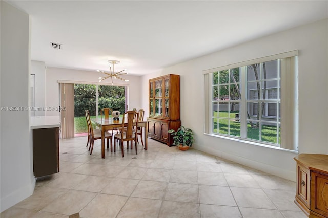 676 NW 133rd Dr, Plantation, FL 33325 - dining space with a chandelier and light tile patterned flooring