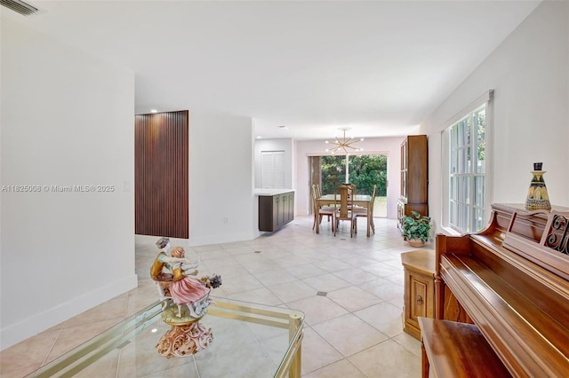 676 NW 133rd Dr, Plantation, FL 33325 - living room featuring plenty of natural light, a chandelier, and light tile patterned floors