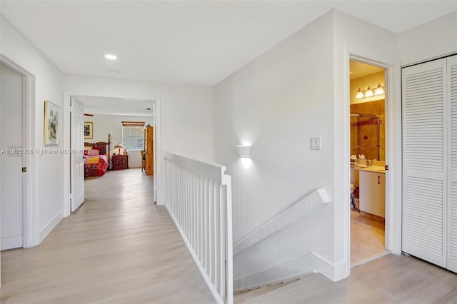 676 NW 133rd Dr, Plantation, FL 33325 - hallway with an upstairs landing, light wood-style flooring, and recessed lighting
