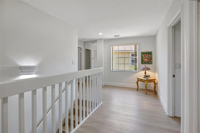 676 NW 133rd Dr, Plantation, FL 33325 - corridor with light wood-style floors, recessed lighting, and a textured ceiling