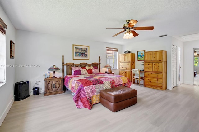 676 NW 133rd Dr, Plantation, FL 33325 - bedroom featuring light wood-style floors, a textured ceiling, and ceiling fan