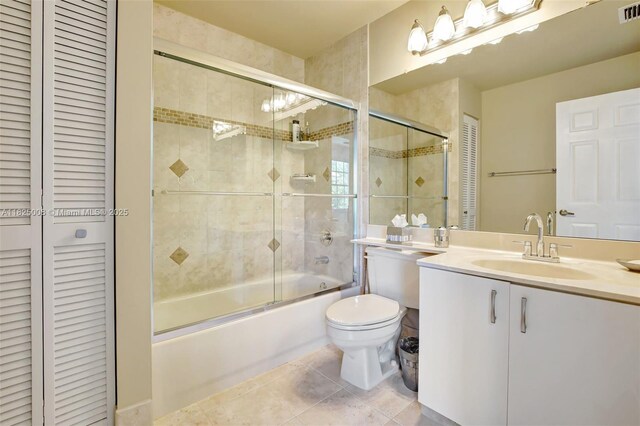 676 NW 133rd Dr, Plantation, FL 33325 - bathroom featuring a closet, enclosed tub / shower combo, vanity, and tile patterned floors
