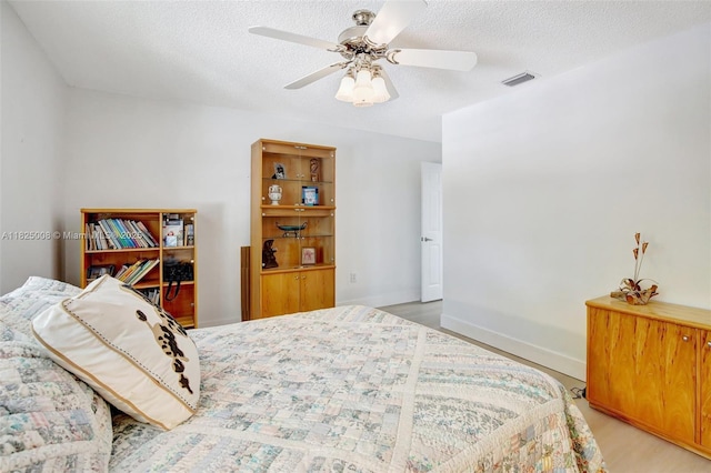676 NW 133rd Dr, Plantation, FL 33325 - bedroom with a textured ceiling, light wood-style floors, and a ceiling fan
