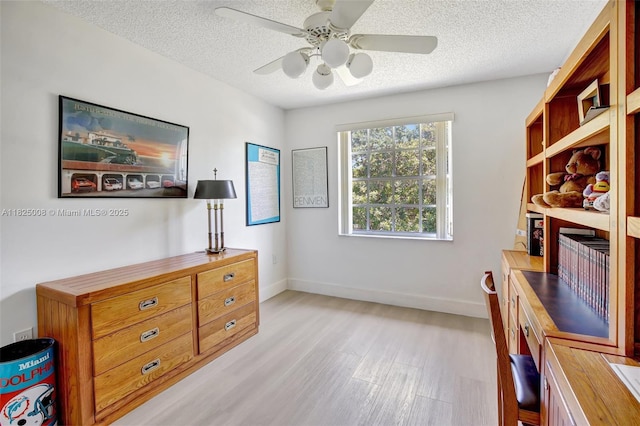 676 NW 133rd Dr, Plantation, FL 33325 - sitting room featuring light wood finished floors, ceiling fan, a textured ceiling, and an office area