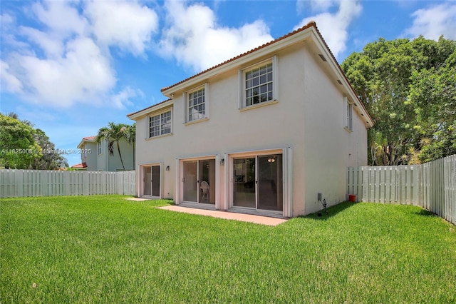 676 NW 133rd Dr, Plantation, FL 33325 - rear view of house with stucco siding and a fenced backyard