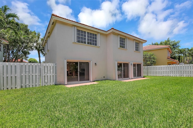 676 NW 133rd Dr, Plantation, FL 33325 - back of property with stucco siding and a tiled roof