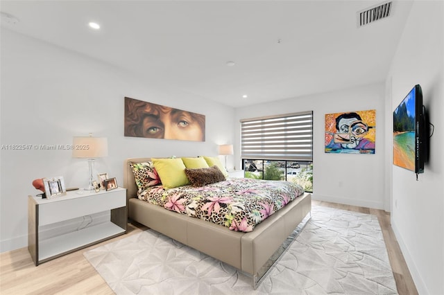 4212 NE 7th Ter, Oakland Park, FL 33334 - bedroom with wood finished floors and recessed lighting