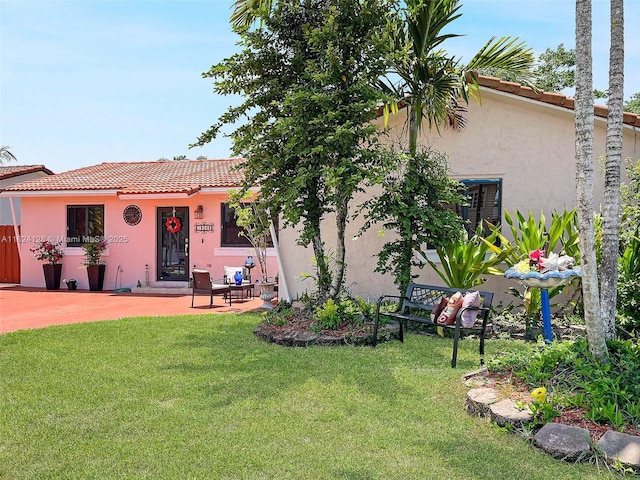 18003 SW 153rd Pl, Miami, FL 33187 - view of front of property featuring stucco siding, a tile roof, and a front yard