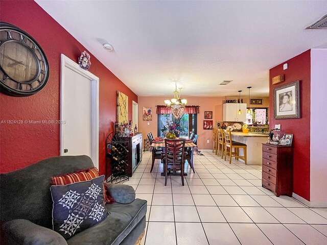 18003 SW 153rd Pl, Miami, FL 33187 - dining area with a chandelier and light tile patterned flooring
