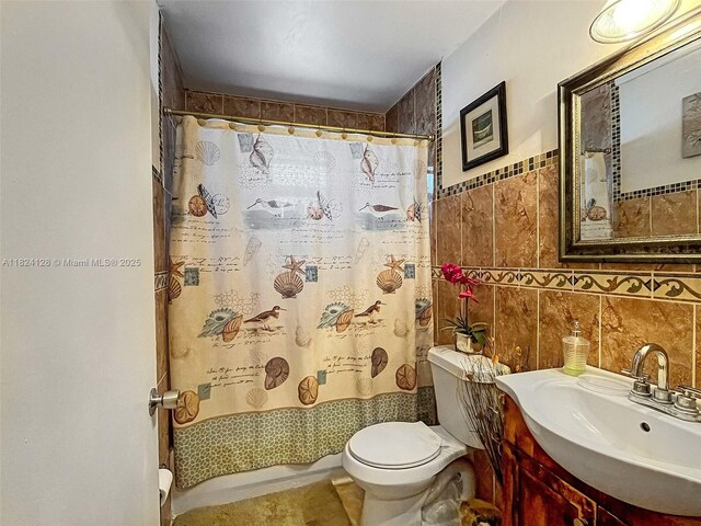 18003 SW 153rd Pl, Miami, FL 33187 - full bathroom featuring tile walls, vanity, and a shower with curtain