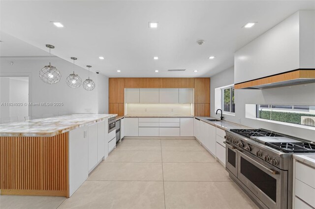 3748 Prairie Ave, Miami Beach, FL 33140 - kitchen featuring range with two ovens, white cabinets, light tile patterned floors, decorative light fixtures, and recessed lighting