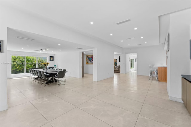 3748 Prairie Ave, Miami Beach, FL 33140 - dining area with light tile patterned floors and recessed lighting