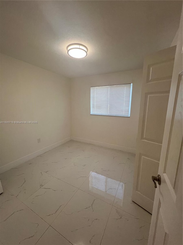 14730 SW 104th Ct, Miami, FL 33176 - empty room featuring light marble finish floors