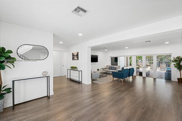 413 Holiday, Hallandale Beach, FL 33009 - living room with wood finished floors, recessed lighting, and french doors