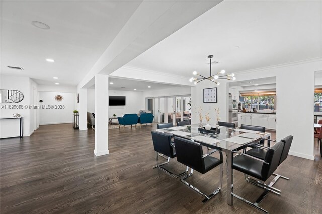 413 Holiday, Hallandale Beach, FL 33009 - dining space with recessed lighting, a chandelier, dark wood finished floors, and ornamental molding