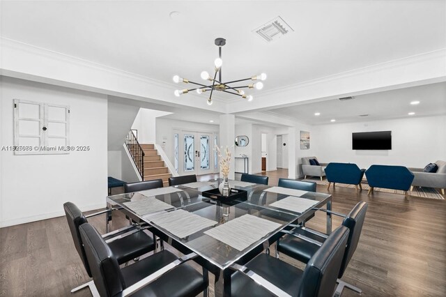 413 Holiday, Hallandale Beach, FL 33009 - dining room with a chandelier, wood finished floors, stairs, french doors, and ornamental molding