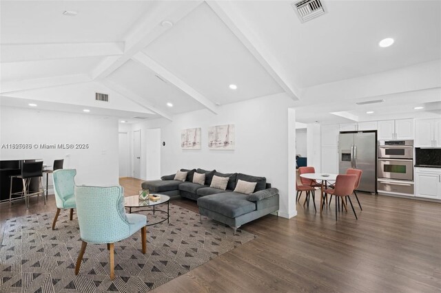 413 Holiday, Hallandale Beach, FL 33009 - living area featuring dark wood-style floors and recessed lighting