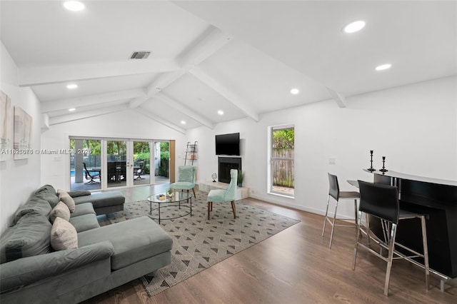 413 Holiday, Hallandale Beach, FL 33009 - living room with plenty of natural light, recessed lighting, wood finished floors, and a fireplace with raised hearth
